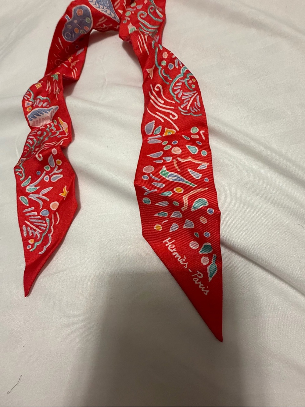 Hermes Red Silk Printed Twilly with Multicolor Motifs